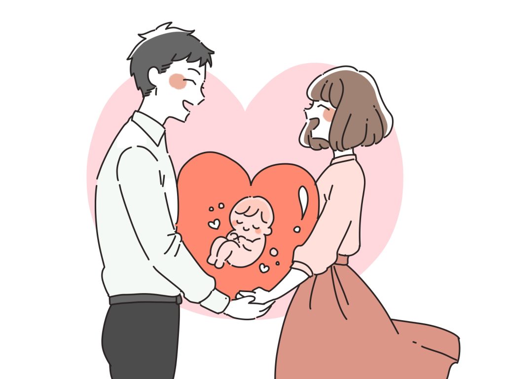 待望の赤ちゃんに喜ぶ男女